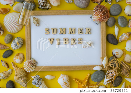 Composition sheet white paper text SUMMER VIBES, seashells, pebbles, mockup on yellow background. Blank, top view, still life, flat lay. sea vacation travel concept tourism and resorts. Composition sheet white paper text SUMMER VIBES, seashells, pebbles, mockup on yellow background. Blank, top view, still life, flat lay. sea vacation travel concept tourism and resorts. 88729551
