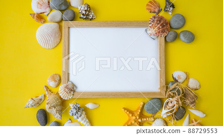 Composition frame for copy space, seashells, pebbles, mockup on yellow background. Blank, top view, still life, flat lay. sea vacation travel concept tourism and resorts. 88729553