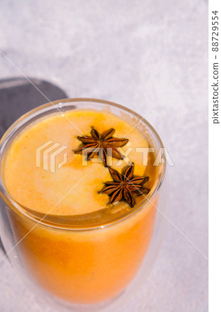 Pumpkin smoothie spiced latte. Anise stars. Autumn coffee with spicy pumpkin flavor seasonal hot drink. Fall Drinks for Halloween and Thanksgiving Pumpkin smoothie spiced latte. Anise stars. Autumn coffee with spicy pumpkin flavor seasonal hot drink. Fall Drinks for Halloween and Thanksgiving 88729554