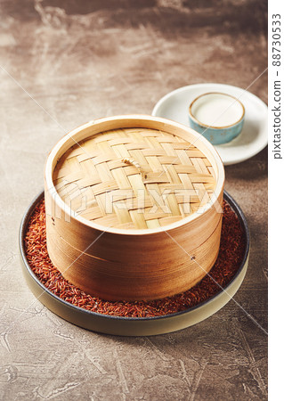 Traditional Asian bamboo steamer for steamed dumplings like Dim Sums or Manti. Asian food background Traditional Asian bamboo steamer for steamed dumplings like Dim Sums or Manti. Asian food background 88730533