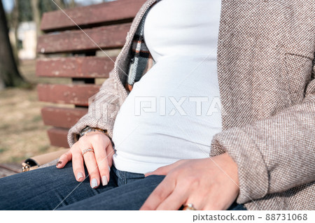 Pregnancy woman walk. Pregnant nature walk. Happy maternity mother in summer park. Baby belly. Pregnancy activity. Pregnancy woman walk. Pregnant nature walk. Happy maternity mother in summer park. Baby belly. Pregnancy activity. 88731068