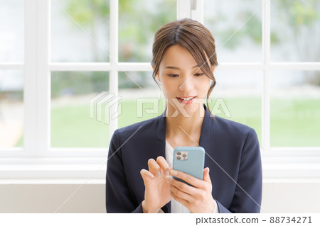 Women's suit with a smartphone 88734271