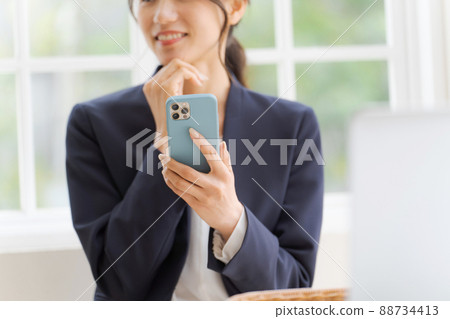 Women with smartphone parts cut 88734413