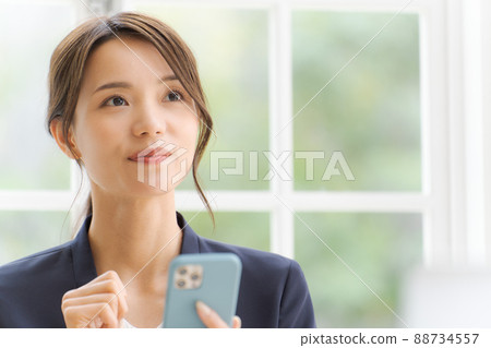 Women's suit with a smartphone Women's suit with a smartphone 88734557