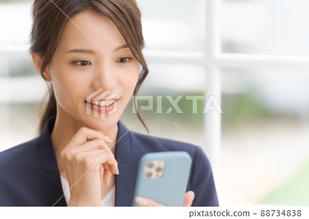 Women's suit with a smartphone 88734838