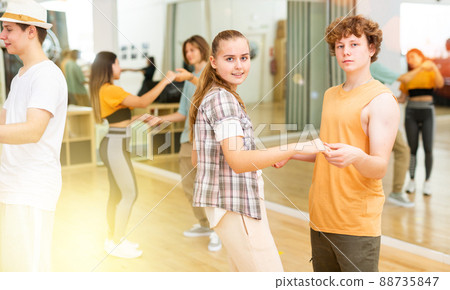 Pairs of youth boys and girls rehearsing in dance studio 88735847