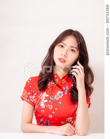 A handicraft lecture by a smiling woman in front of a white background. A handicraft lecture by a smiling woman in front of a white background. 88738366