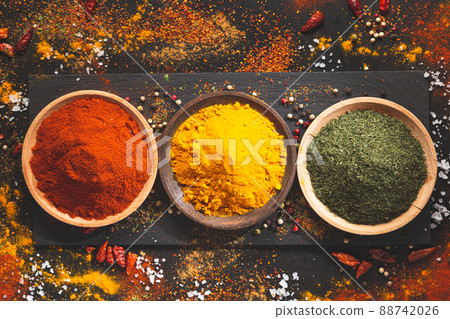 Various spices on a black background, top view. Condiments of cooking concept. 88742026