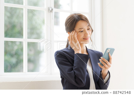 Women's suit with a smartphone 88742548