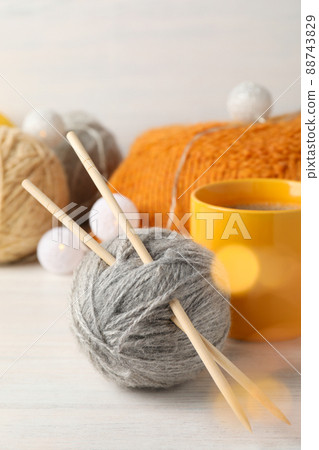 Concept of knitting on white wooden table, close up Concept of knitting on white wooden table, close up 88743829