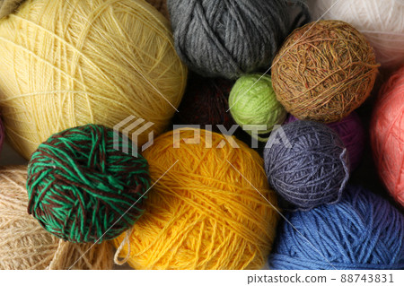 Balls of yarn all over background, closeup Balls of yarn all over background, closeup 88743831