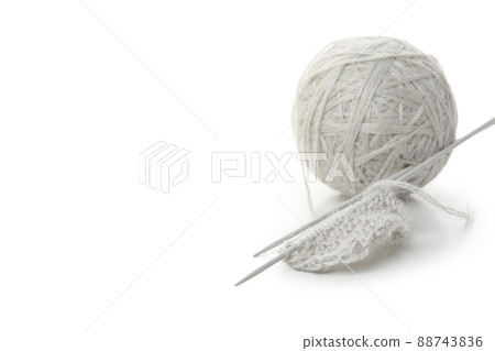Ball of yarn with knitting needles isolated on white background Ball of yarn with knitting needles isolated on white background 88743836