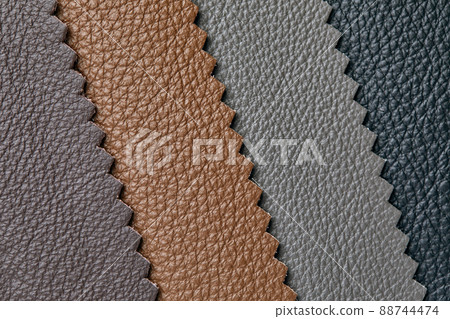 Samples of beige, brown, gray black leather. Leather crafts and craftwork. View from above. 88744474