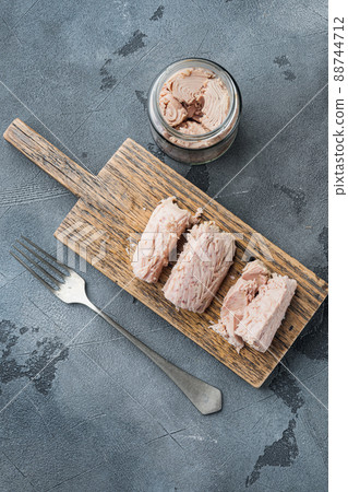 Canned tuna fillet in olive oil , on gray background, top view 88744712