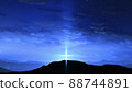 Bright cross on the hill with clouds moving on the blue starry sky 88744891