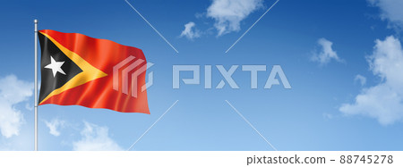 East Timor flag isolated on a blue sky. Horizontal banner 88745278
