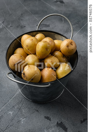 Organic White Baby Potatoes, on gray stone table background, with copy space for text 88746076
