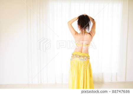 Back view of a woman dancing belly dance Back view of a woman dancing belly dance 88747686
