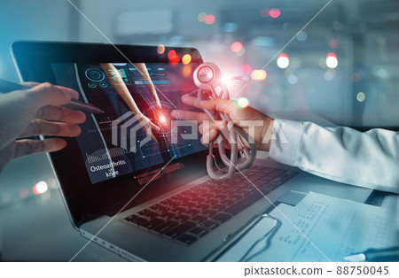 Medicine doctor team meeting and analysis. Diagnose checking osteoarthritis knee testing result with modern virtual interface on laptop, Joint ache problems, Medical technology network. Medicine doctor team meeting and analysis. Diagnose checking osteoarthritis knee testing result with modern virtual interface on laptop, Joint ache problems, Medical technology network. 88750045