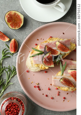 Concept of tasty food with bruschetta with fig on gray textured table 88750312