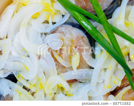 Salted fish sprinkled with chopped onions and sprinkled with vegetable oil. Salted fish sprinkled with chopped onions and sprinkled with vegetable oil. 88751882