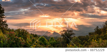 Panorama dramatic sunrise shining on mountain with foggy in the valley at national park 88752229