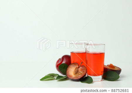 Plum brandy shots and ingredients on white background Plum brandy shots and ingredients on white background 88752681