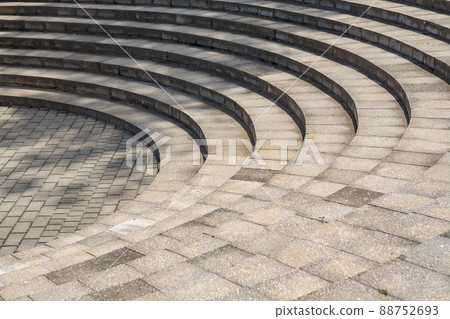 Towering round concrete stairs like an ancient amphitheater Towering round concrete stairs like an ancient amphitheater 88752693