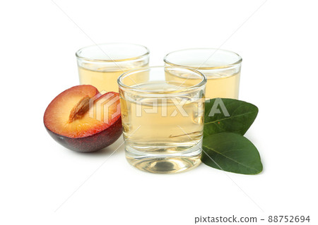 Plum vodka shots isolated on white background Plum vodka shots isolated on white background 88752694