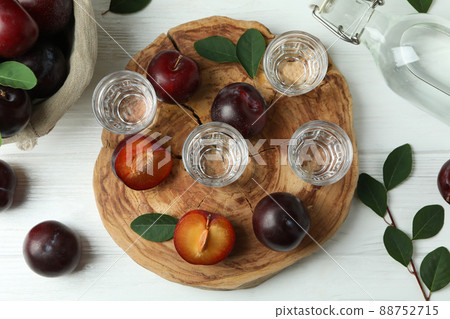 Concept of alcohol with plum vodka, top view Concept of alcohol with plum vodka, top view 88752715
