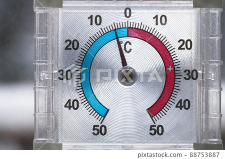 Outdoor window thermometer shows negative temperature in degrees Celsius Outdoor window thermometer shows negative temperature in degrees Celsius 88753887