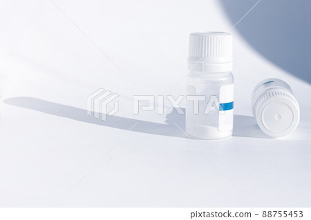 Yogurt starter cultures in medicine bottle on white background. Homemade fermented milky drinks. Healthy eating, diet. Yogurt starter cultures in medicine bottle on white background. Homemade fermented milky drinks. Healthy eating, diet. 88755453
