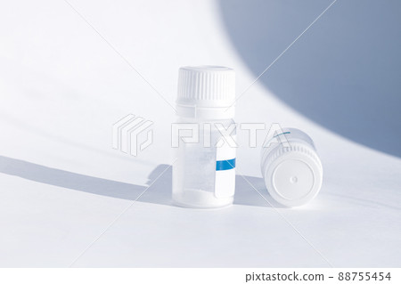 Yogurt starter cultures in medicine bottle on white background. Homemade fermented milky drinks. Healthy eating, diet. Yogurt starter cultures in medicine bottle on white background. Homemade fermented milky drinks. Healthy eating, diet. 88755454