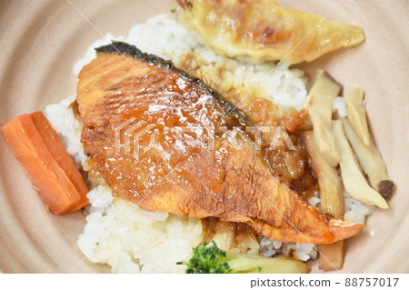 grilled salmon soy sauce with pork dumpling and vegetable topping on Japanese rice in bowl grilled salmon soy sauce with pork dumpling and vegetable topping on Japanese rice in bowl 88757017