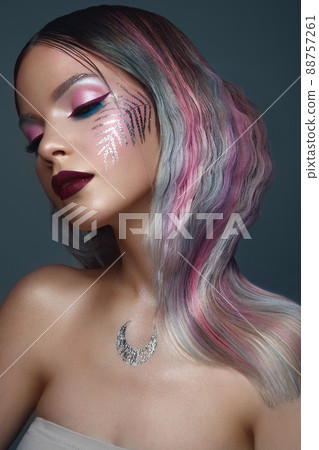 Beautiful girl with multi-colored hair and creative make up and hairstyle. Beauty face. 88757261