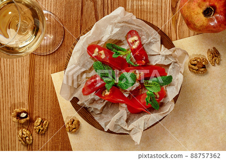 Traditional Georgian sweet Churchkhela with walnuts and pomegranate juice 88757362