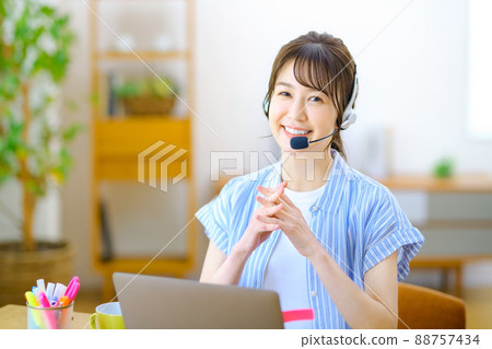 Operator during telework to chat at home using a personal computer Operator during telework to chat at home using a personal computer 88757434
