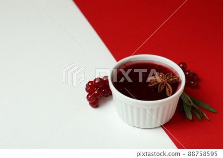 Cranberry sauce and ingredients on two tone background Cranberry sauce and ingredients on two tone background 88758595