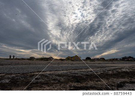 A beautiful dark sky over a beach. Picture from Gilleleje, Denmark A beautiful dark sky over a beach. Picture from Gilleleje, Denmark 88759443