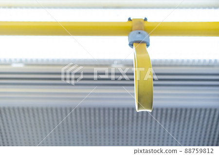 Close up the rubber - plastic cable hand holding in ariport rail link train. Close up the rubber - plastic cable hand holding in ariport rail link train. 88759812