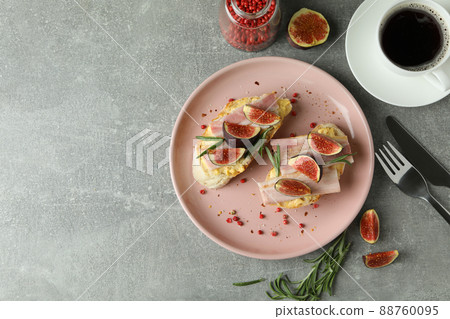 Concept of tasty food with bruschetta with fig on gray textured table Concept of tasty food with bruschetta with fig on gray textured table 88760095