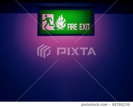 Fire exit door. Fire exit emergency door red color metal material with alarm and emergency light and fire extinguish equipment on building wall for safety protection. Doors for escape conflagration. Fire exit door. Fire exit emergency door red color metal material with alarm and emergency light and fire extinguish equipment on building wall for safety protection. Doors for escape conflagration. 88760236