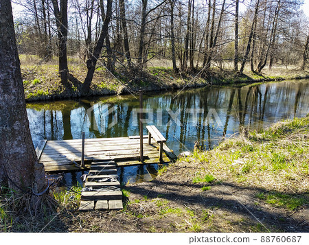 Wooden raft on small stream in wood Wooden raft on small stream in wood 88760687