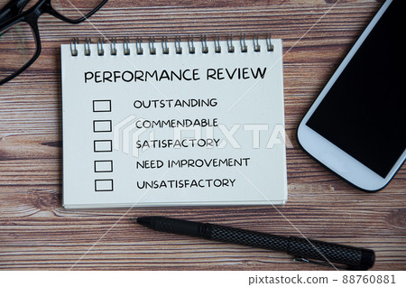Performance appraisal checklist on notepad with with office setting background. Performance appraisal checklist on notepad with with office setting background. 88760881