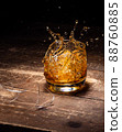Broken whiskey glass 88760885
