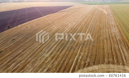 Aerial drone view flight over different agricultural fields field after harvest Aerial drone view flight over different agricultural fields field after harvest 88761416