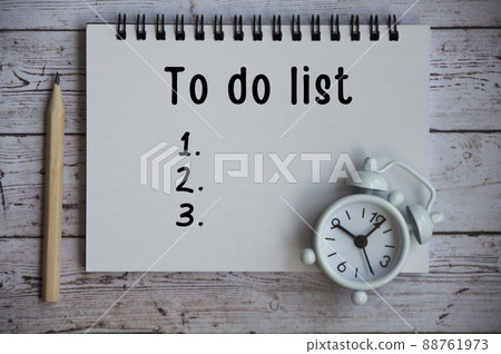 To Do List text on notepad - White alarm clock. 88761973