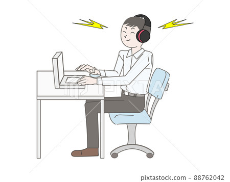 A man with a hearing impairment is working on a computer with an earmuff for desk work 88762042