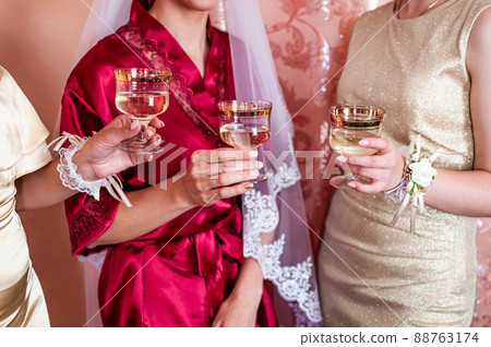 bride and groom clink glasses with champagne bride and groom clink glasses with champagne 88763174