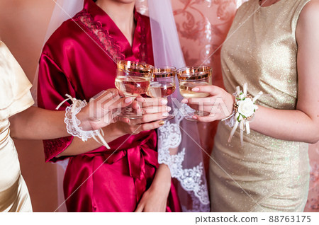 bride and groom clink glasses with champagne bride and groom clink glasses with champagne 88763175